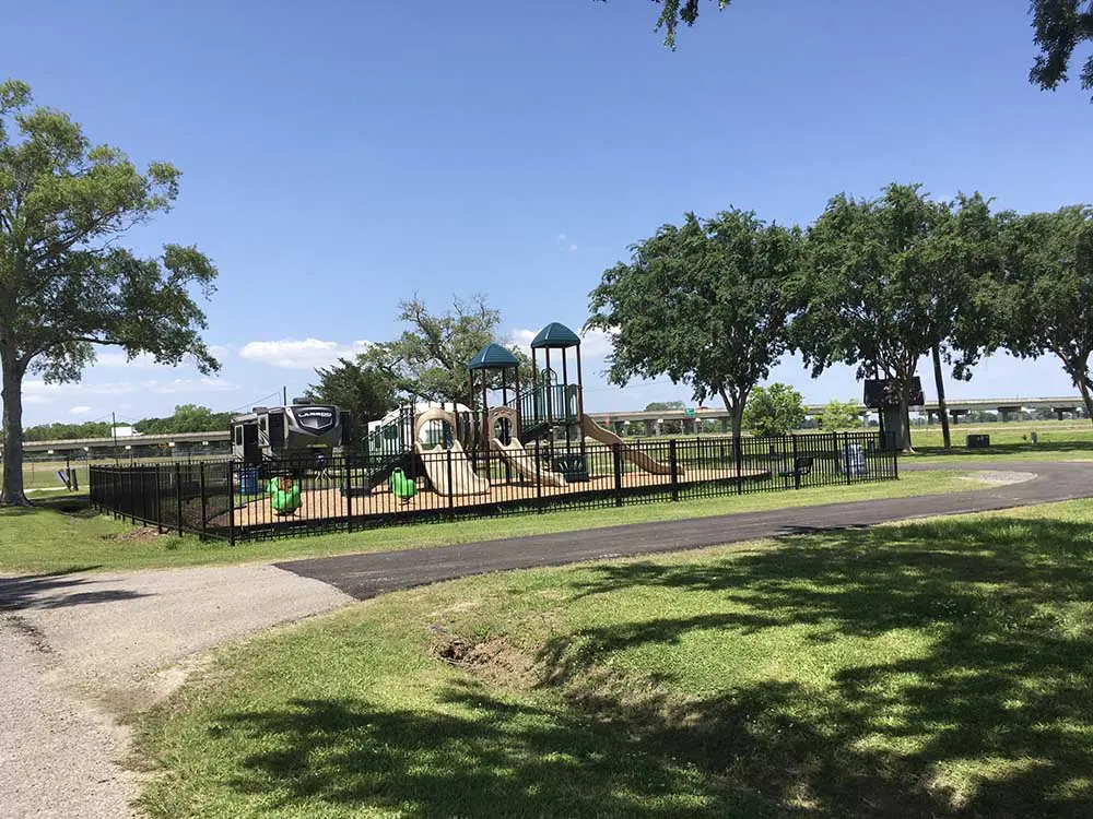 Screenshot A park with several playgrounds and trees.